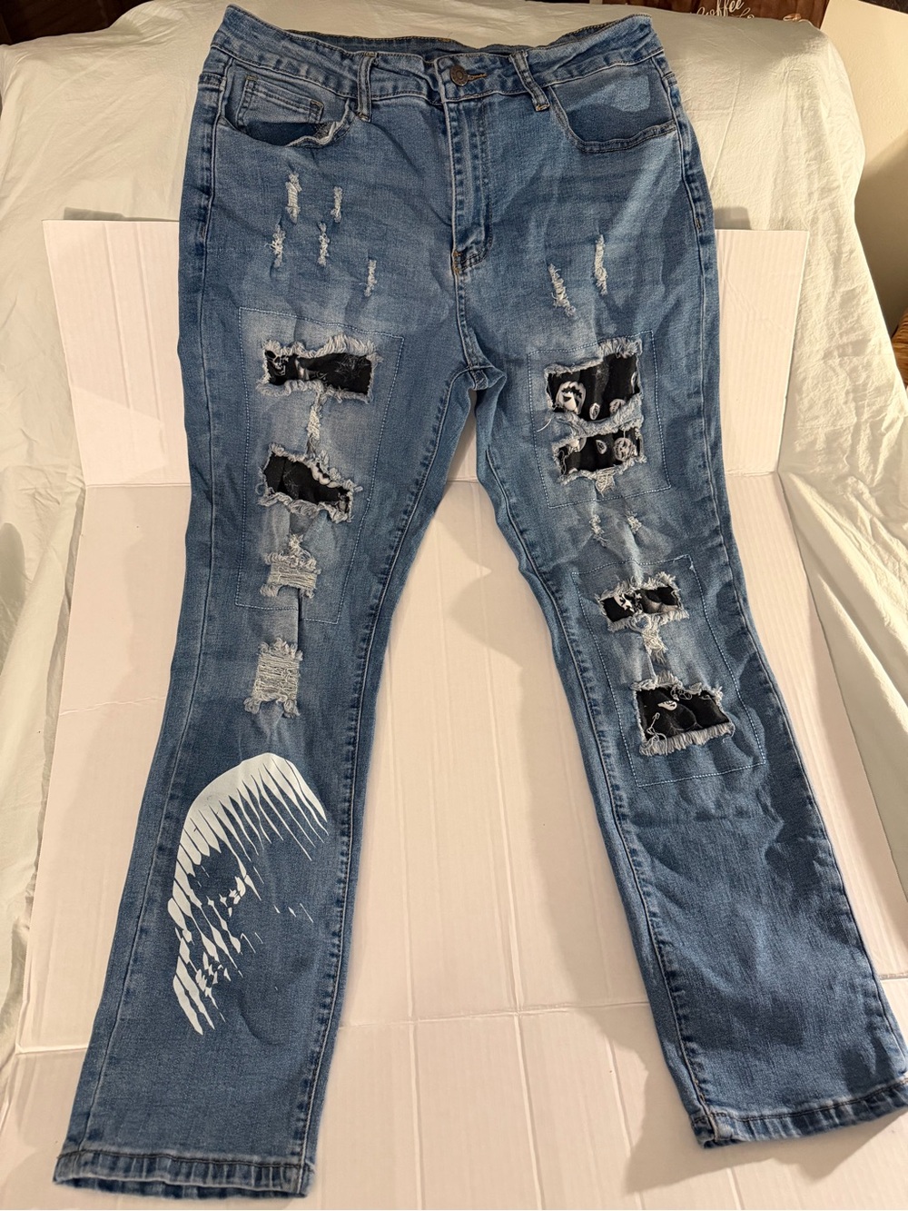 #221 Distressed Blue Women’s Ripped Jeans with Patch Detail